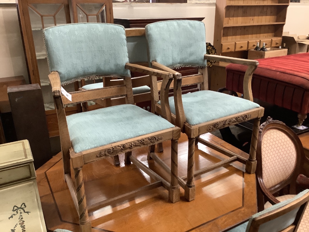 A set of six 1920's oak dining chairs two with arms